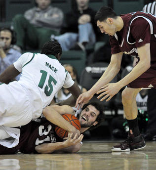 Luke Bonner wrestles control of the loose ball away from Lamont Mack, with Tony Gaffney ready to help