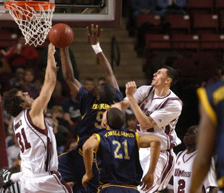 Tony Gaffney swats Kimmani Barrett's shot away