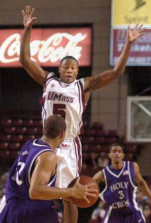 Ricky Harris cuts off  the passing lane between RJ Evans and Lawrence Dixon