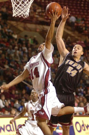 Chris Lowe lays it up in front of Billy Pettiford