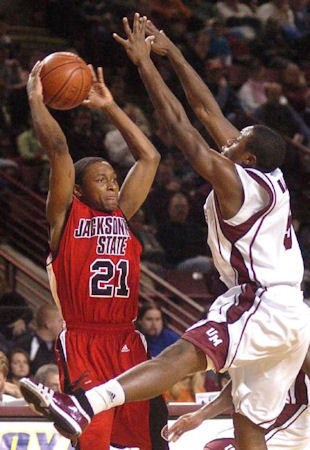 Ricky Harris makes the pass difficult for John Barnes